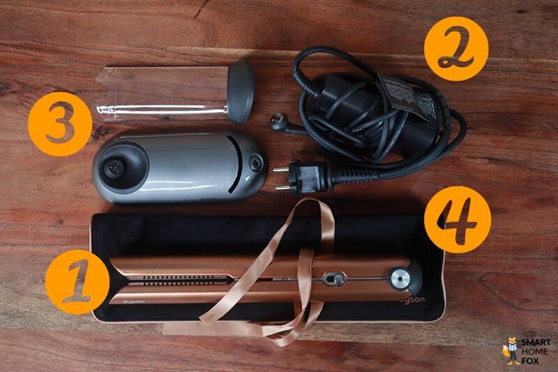 Man sieht den Lieferumfang des Dyson Corrale.